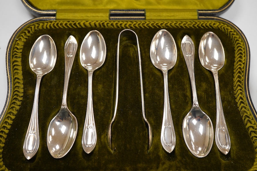 A cased set of six George V silver teaspoons and pair of sugar tongs, by Walker & Hall, Sheffield, 1918, together with a set of ten sterling coffee spoons, with floral terminals, a sterling tea strainer and a boxed Eliza